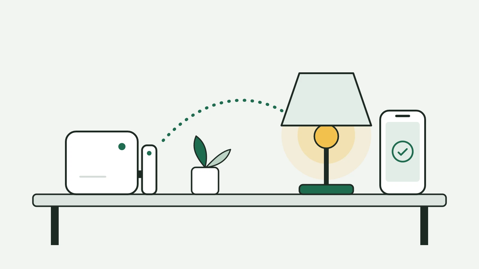 Home Assistant con la chiavetta Thread, una lampada da tavolo accesa e un telefono con il segno di spunta sullo stesso ripiano